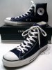 A_classic_Black_pair_of_Converse_All_Stars_resting_on_the_Black_&_White_Ed._Shoebox_(1998-2002).JPG